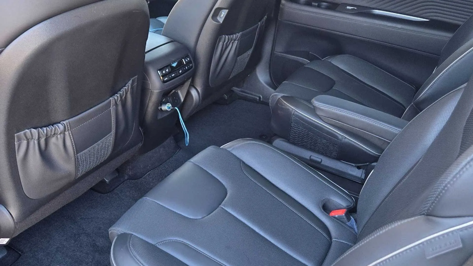 Clean black leather rear seats after professional car interior detailing in Lancaster, California