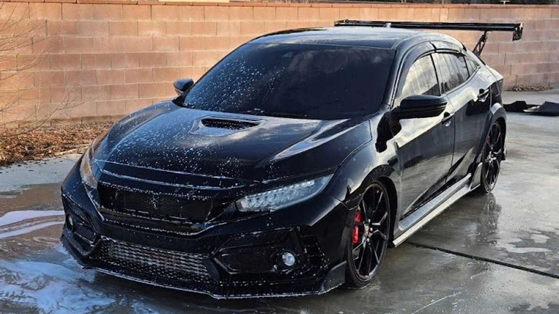 Black Honda Civic Type R receiving a foam wash during it's Palmdale mobile auto detailing service